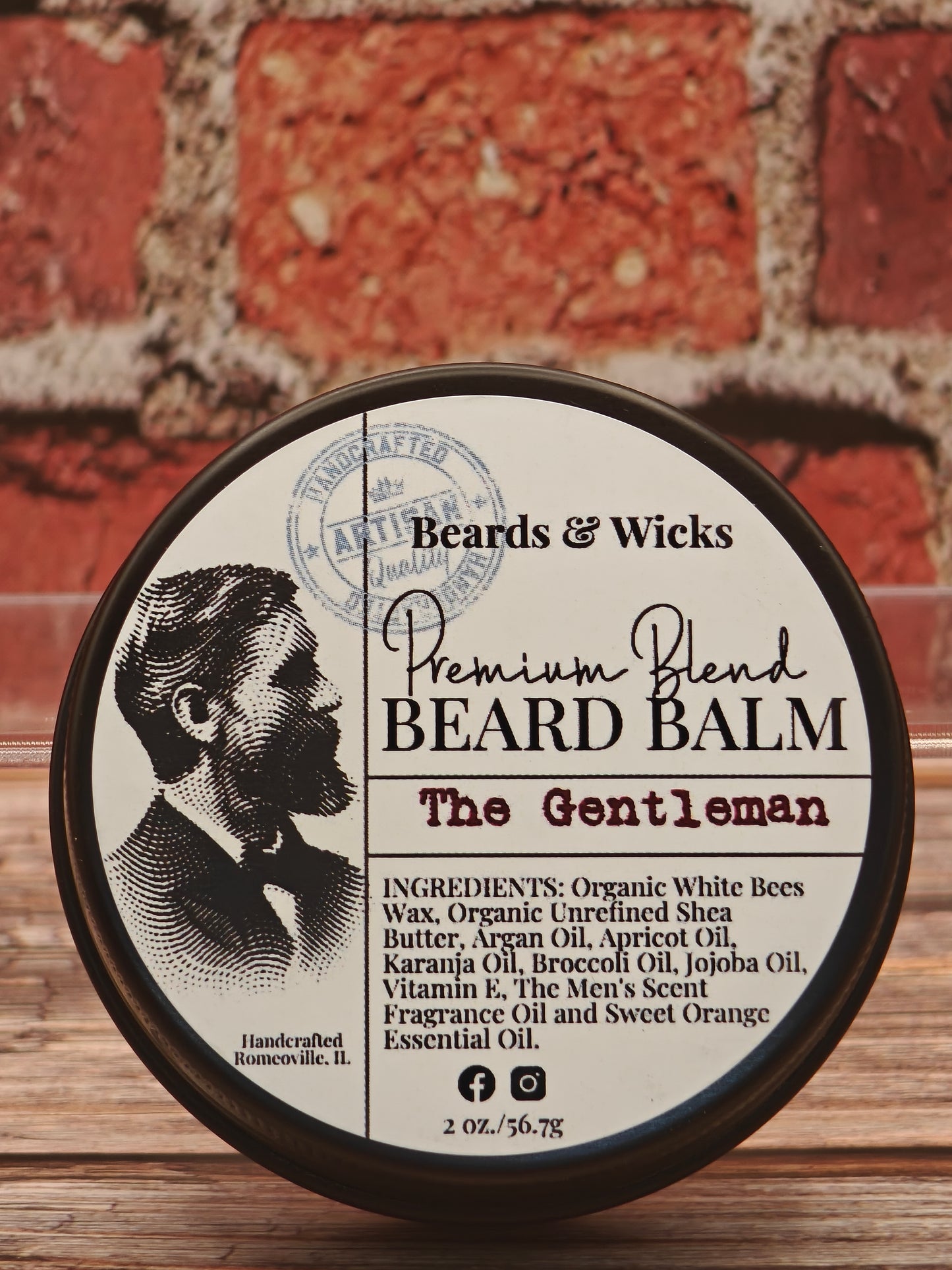 Beards & Wicks Premium Blend Beard Balm in The Gentleman - 2 oz tin featuring vintage barber illustration, handcrafted in Romeoville, IL with organic ingredients including white beeswax, shea butter, argan oil, and jojoba oil for beard conditioning and styling