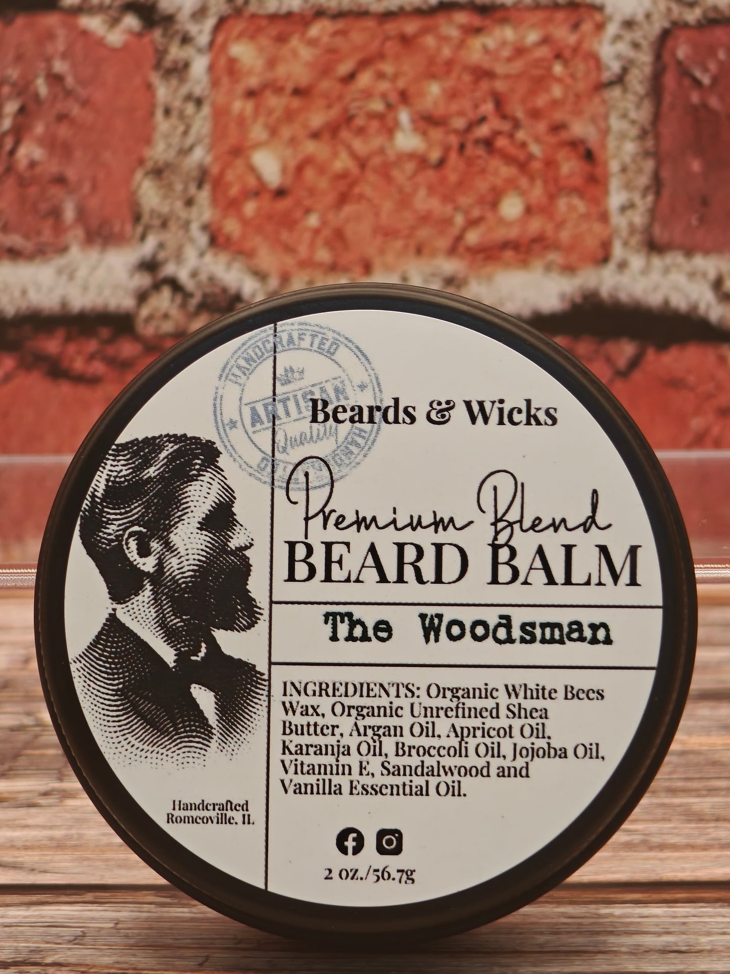 Beards & Wicks Premium Blend Beard Balm in The Woodsman - 2 oz tin featuring vintage barber illustration, handcrafted in Romeoville, IL with organic ingredients including white beeswax, shea butter, argan oil, and jojoba oil for beard conditioning and styling