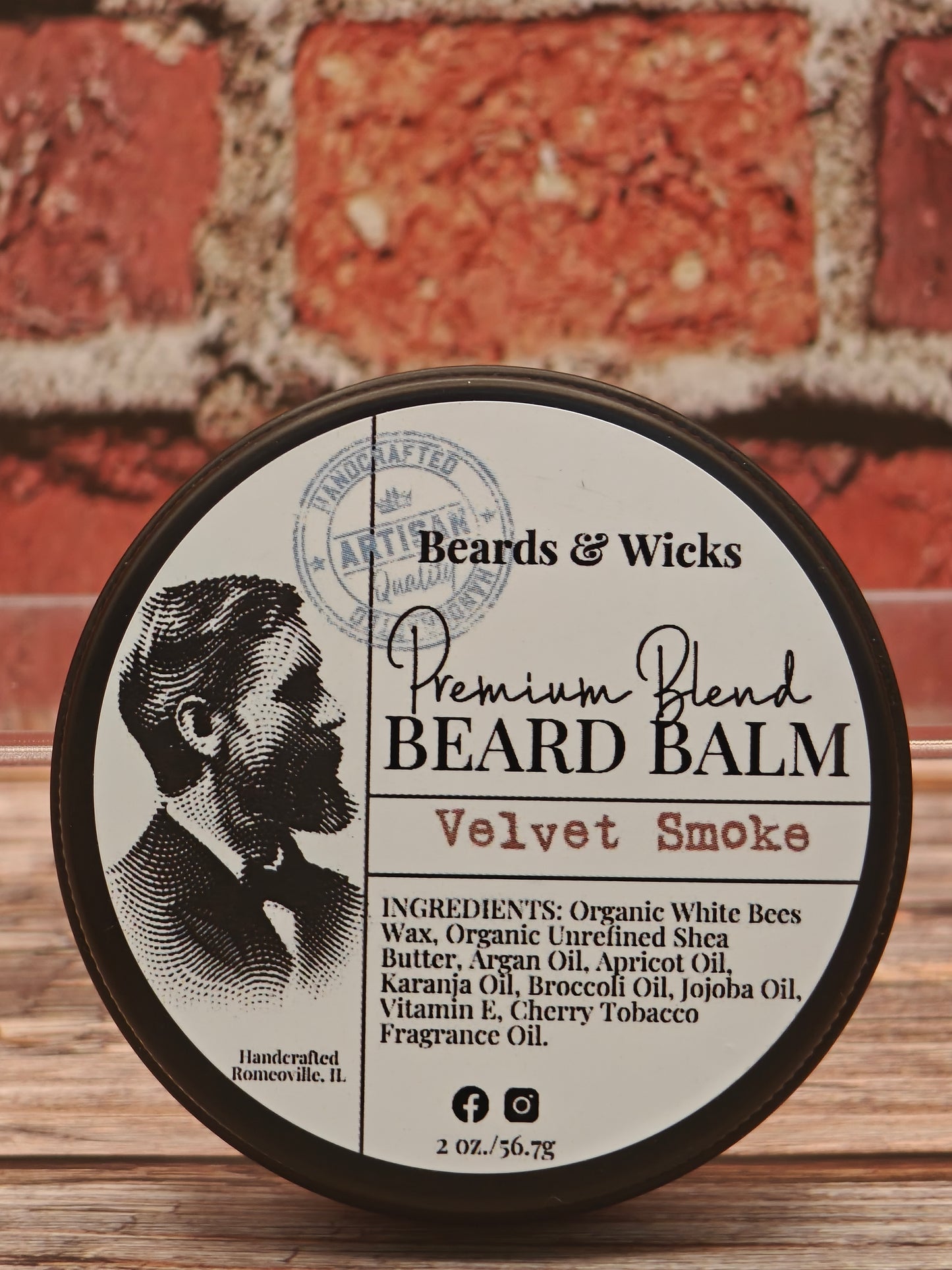 Beards & Wicks Premium Blend Beard Balm in Velvet Smoke - 2 oz tin featuring vintage barber illustration, handcrafted in Romeoville, IL with organic ingredients including white beeswax, shea butter, argan oil, and jojoba oil for beard conditioning and styling