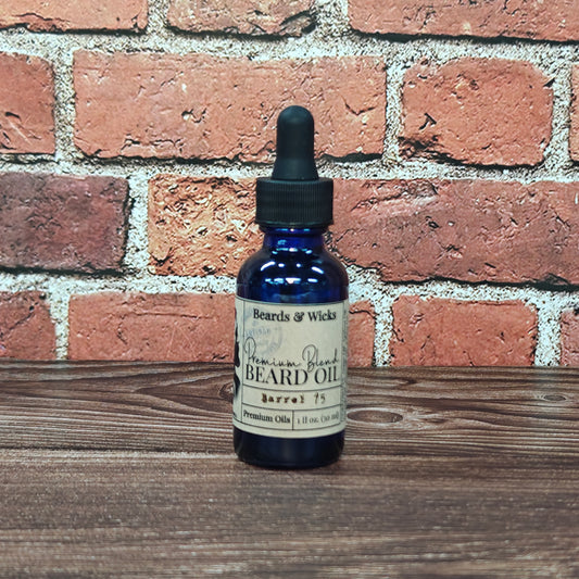 Beards & Wicks' Barrel 75 Premium Beard Oil - 1 oz blue glass dropper bottle with kraft paper label, handcrafted in Romeoville, IL with organic oils including jojoba, argan, and broccoli seed oil for beard nourishment and conditioning