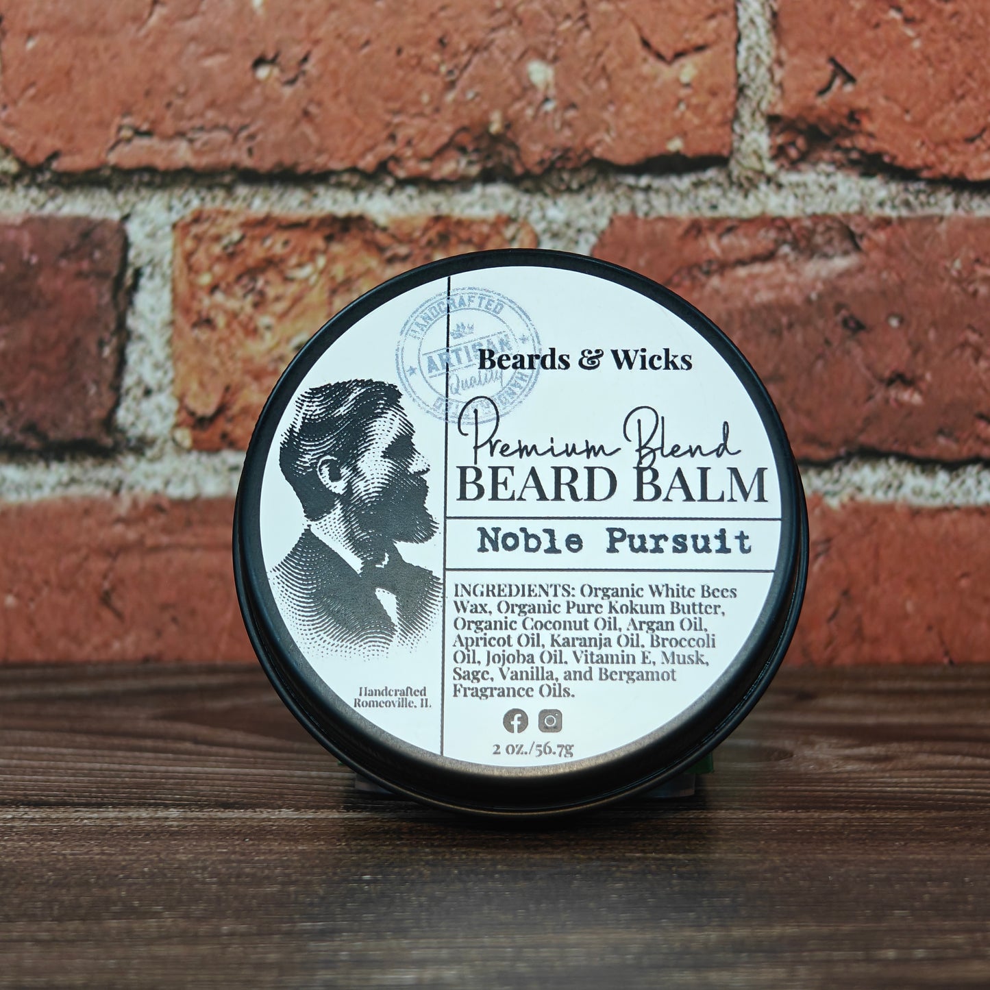 Beards & Wicks Premium Blend Beard Balm in Noble Pursuit - 2 oz tin featuring vintage barber illustration, handcrafted in Romeoville, IL with organic ingredients including white beeswax, shea butter, argan oil, and jojoba oil for beard conditioning and styling