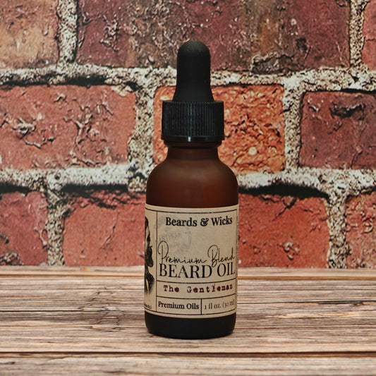 Beards & Wicks' The Gentleman Premium Beard Oil - 1 oz amber glass dropper bottle with kraft paper label, handcrafted in Romeoville, IL with organic oils including jojoba, argan, and broccoli seed oil for beard nourishment and conditioning