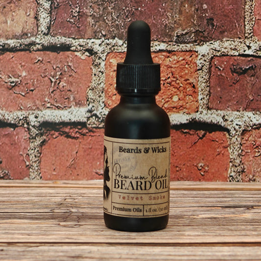 Beards & Wicks' Velvet Smoke Premium Beard Oil - 1 oz black glass dropper bottle with kraft paper label, handcrafted in Romeoville, IL with organic oils including jojoba, argan, and broccoli seed oil for beard nourishment and conditioning