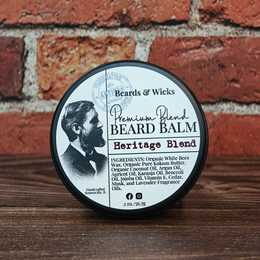 Beards & Wicks Premium Blend Beard Balm in Heritage Blend - 2 oz tin featuring vintage barber illustration, handcrafted in Romeoville, IL with organic ingredients including white beeswax, shea butter, argan oil, and jojoba oil for beard conditioning and styling